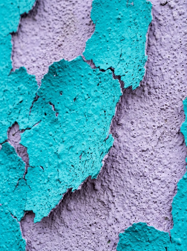 macro close-up of peeling textured surface, bright turquoise irregular organic shapes over a light lavender purple background, heavy stippled porous stucco texture on all layers, raised jagged edges with soft drop shadows, vertical orientation, vibrant color contrast, abstract tactile composition