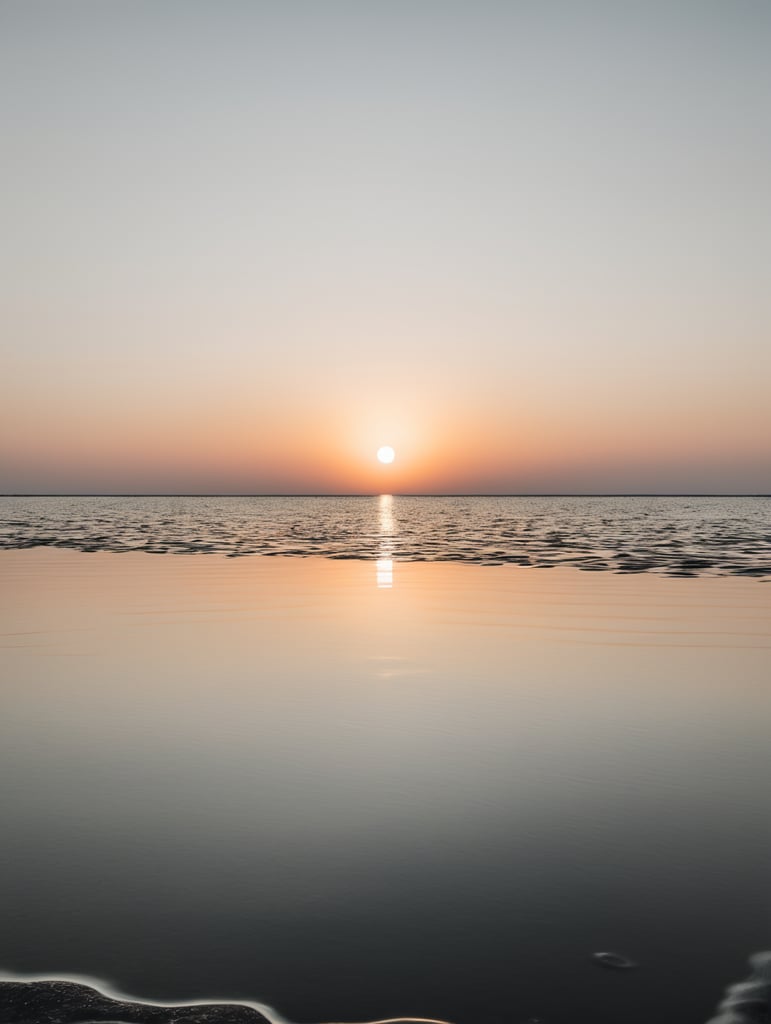 minimal, simple black circle hover above the water and reflecting, just the horizon on the background